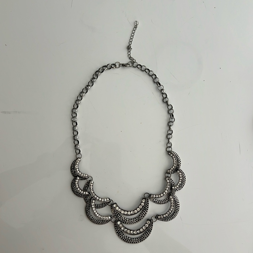 Necklace silver metal with adjustable clasp.